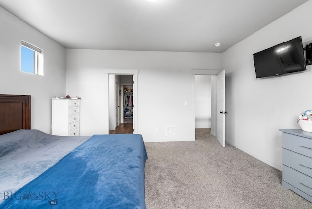 bedroom featuring baseboards, visible vents, and carpet flooring