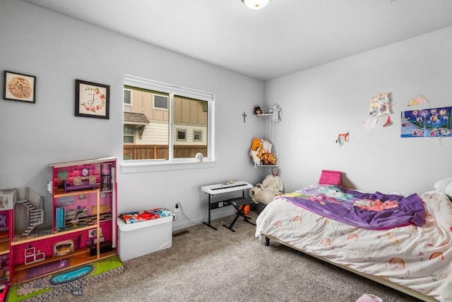 carpeted bedroom with baseboards