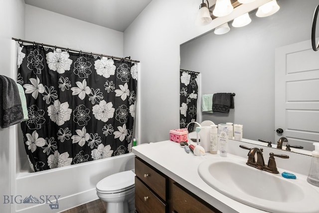 full bath featuring shower / bath combo, wood finished floors, toilet, and vanity