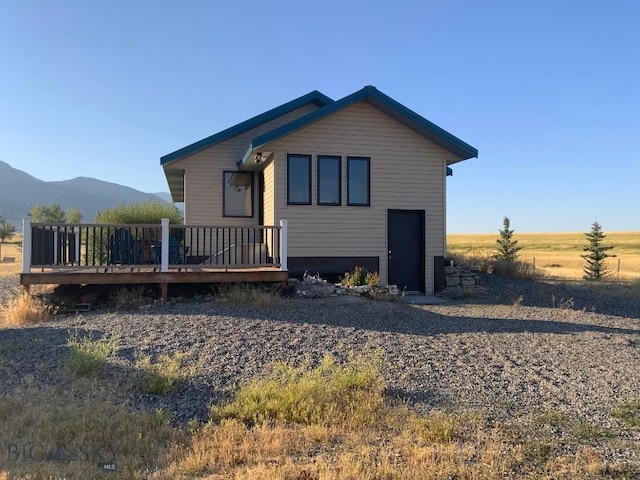 36 Rowdy Way, Ennis, MT 59729 - back of house with a deck with mountain view