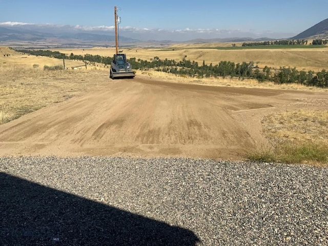 36 Rowdy Way, Ennis, MT 59729 - view of dirt / gravel road with a view of rural / pastoral area and a mountain view