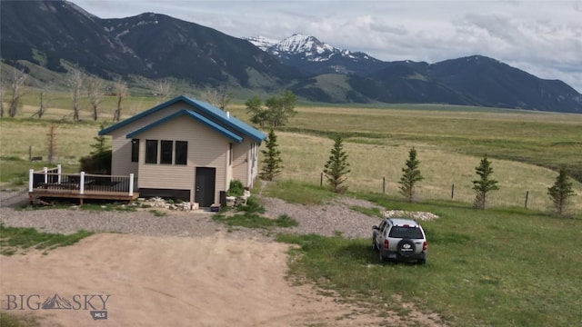 36 Rowdy Way, Ennis, MT 59729 - view of front of property with a deck with mountain view and a view of rural / pastoral area