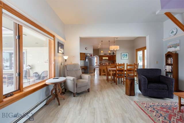 175 Vandyke Rd, Bozeman, MT 59718 - living area featuring a baseboard heating unit and light wood finished floors