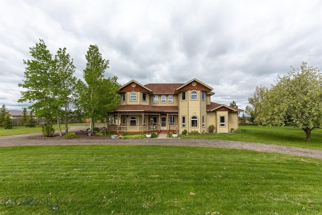 175 Vandyke Rd, Bozeman, MT 59718 - victorian house with a porch, a front lawn, and curved driveway