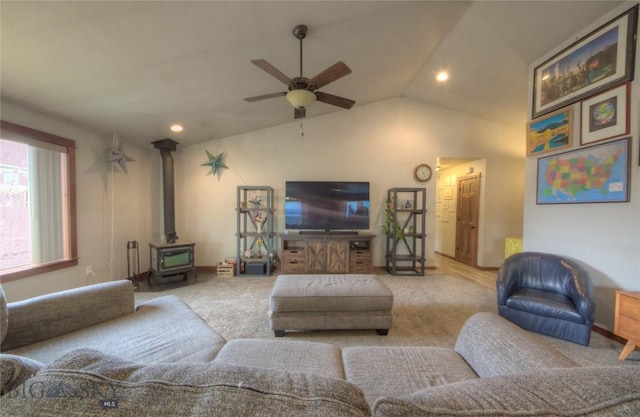 813 Pleiades Pl, Livingston, MT 59047 - living area featuring a wood stove, ceiling fan, carpet floors, recessed lighting, and lofted ceiling