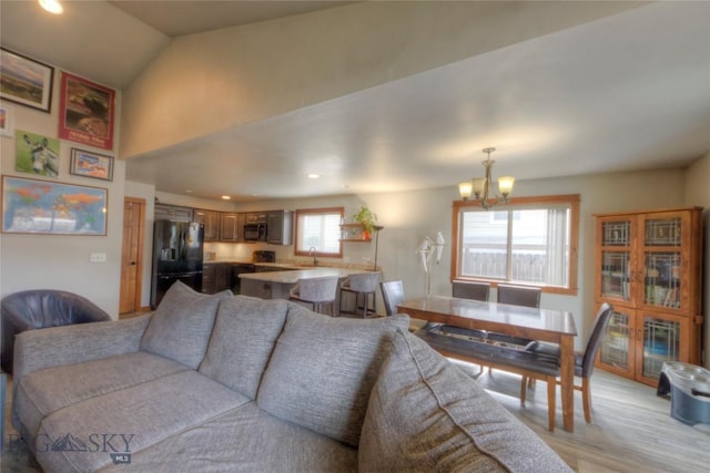 813 Pleiades Pl, Livingston, MT 59047 - living room featuring light wood-type flooring, recessed lighting, and an inviting chandelier