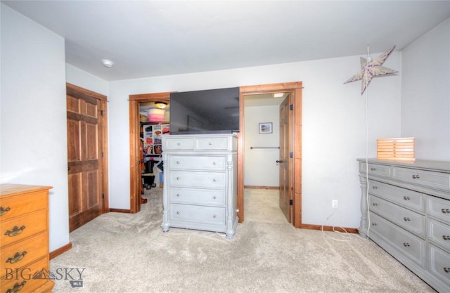 813 Pleiades Pl, Livingston, MT 59047 - bedroom featuring a closet, baseboards, a walk in closet, and light colored carpet