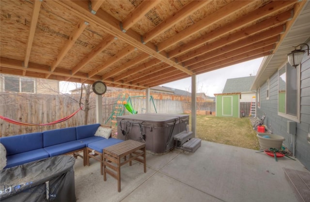 813 Pleiades Pl, Livingston, MT 59047 - view of patio with a fenced backyard, a storage shed, an outdoor structure, and a hot tub