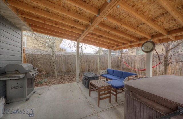813 Pleiades Pl, Livingston, MT 59047 - view of patio featuring area for grilling, a fenced backyard, outdoor lounge area, and a hot tub