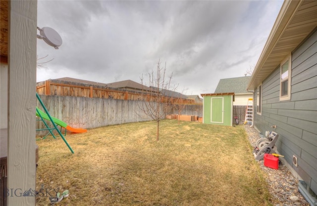 813 Pleiades Pl, Livingston, MT 59047 - view of yard with a fenced backyard, an outdoor structure, and a storage unit