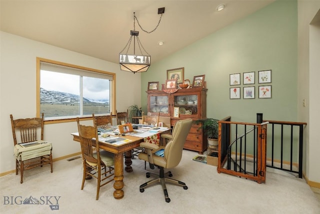 37 Bridger Meadow Ln, Emigrant, MT 59065 - carpeted dining room featuring vaulted ceiling, baseboards, and a desk