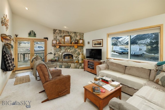 37 Bridger Meadow Ln, Emigrant, MT 59065 - carpeted living room featuring a stone fireplace, lofted ceiling, and recessed lighting