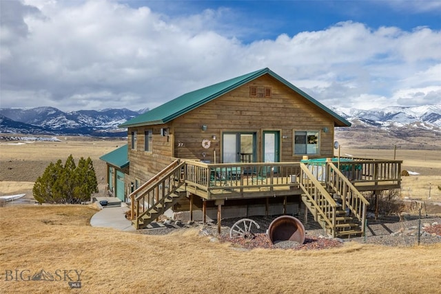 37 Bridger Meadow Ln, Emigrant, MT 59065 - rear view of house featuring stairway, a deck with mountain view, and metal roof