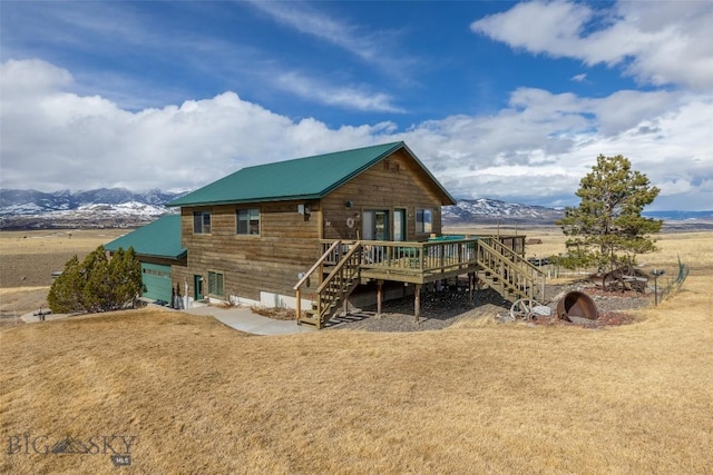 37 Bridger Meadow Ln, Emigrant, MT 59065 - rear view of property with stairs, a deck with mountain view, and metal roof