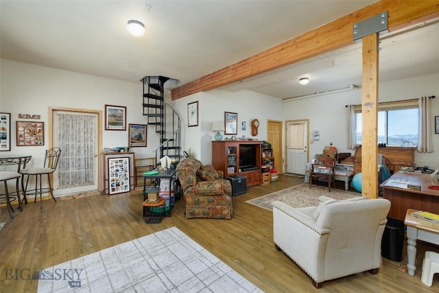 37 Bridger Meadow Ln, Emigrant, MT 59065 - living room featuring stairs, wood finished floors, and beam ceiling
