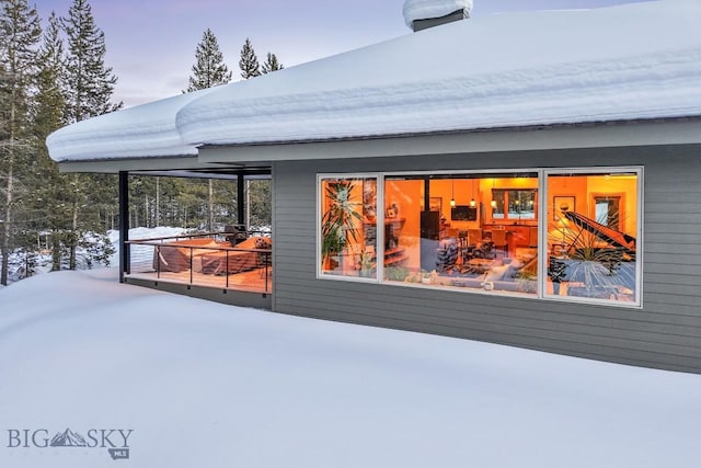 214 W Pine Cone Ter, Big Sky, MT 59716 - view of snow covered rear of property