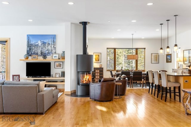 214 W Pine Cone Ter, Big Sky, MT 59716 - living area with light wood-style flooring and recessed lighting