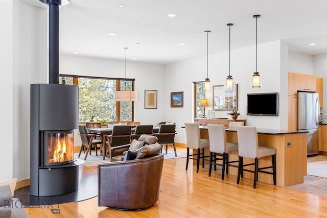 214 W Pine Cone Ter, Big Sky, MT 59716 - living room featuring light wood finished floors and recessed lighting