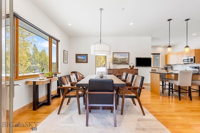 214 W Pine Cone Ter, Big Sky, MT 59716 - dining space with light wood-type flooring and recessed lighting