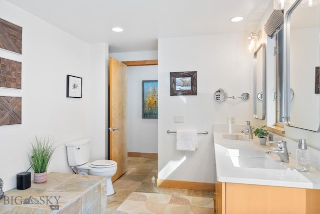 214 W Pine Cone Ter, Big Sky, MT 59716 - bathroom with double vanity, recessed lighting, and stone finish flooring