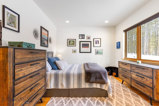 214 W Pine Cone Ter, Big Sky, MT 59716 - bedroom featuring wood finished floors and recessed lighting