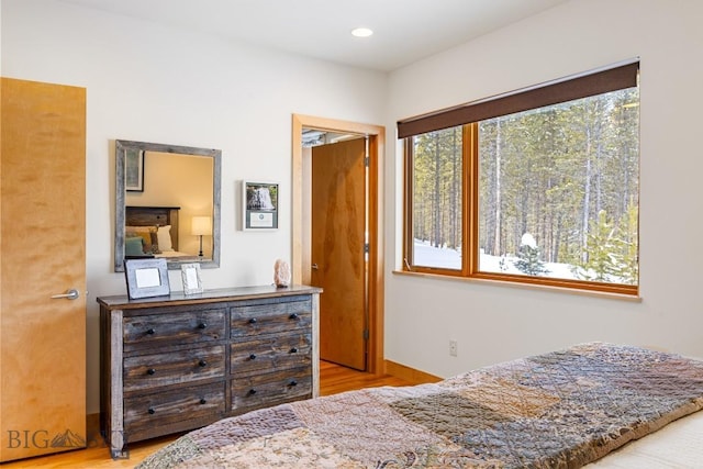 214 W Pine Cone Ter, Big Sky, MT 59716 - bedroom with wood finished floors and recessed lighting
