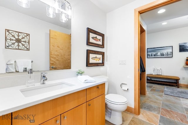 214 W Pine Cone Ter, Big Sky, MT 59716 - bathroom featuring vanity, stone finish flooring, and recessed lighting