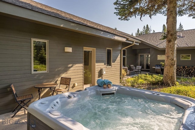 214 W Pine Cone Ter, Big Sky, MT 59716 - view of patio / terrace featuring a hot tub