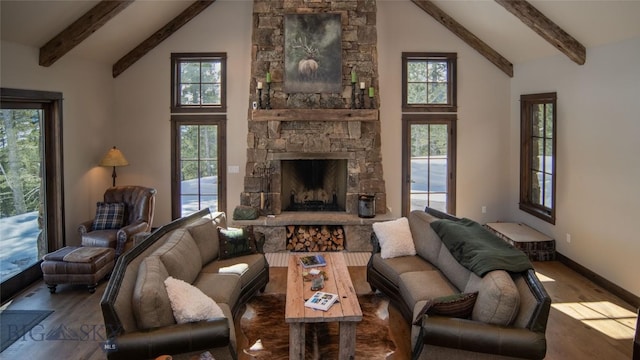11310 Taiga Trl, Bozeman, MT 59715 - living room with wood finished floors, beamed ceiling, a fireplace, high vaulted ceiling, and plenty of natural light