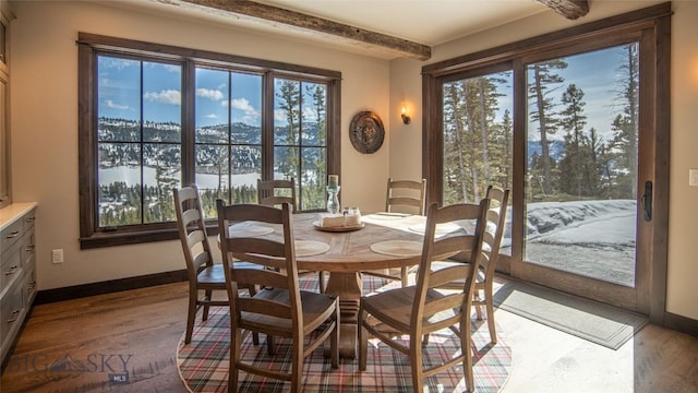 11310 Taiga Trl, Bozeman, MT 59715 - dining space with dark wood-type flooring, healthy amount of natural light, and beam ceiling
