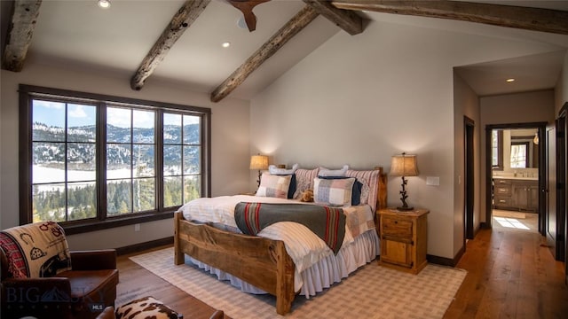 11310 Taiga Trl, Bozeman, MT 59715 - bedroom with light wood-type flooring, recessed lighting, and ensuite bathroom