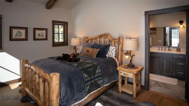 11310 Taiga Trl, Bozeman, MT 59715 - bedroom featuring multiple windows, beamed ceiling, and ensuite bath