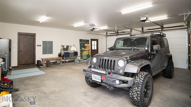 11310 Taiga Trl, Bozeman, MT 59715 - garage featuring a garage door opener and electric panel