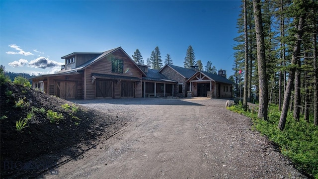 11310 Taiga Trl, Bozeman, MT 59715 - view of front of property featuring dirt driveway and an attached garage