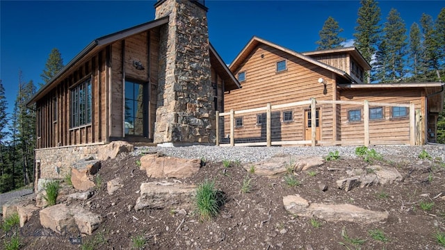 11310 Taiga Trl, Bozeman, MT 59715 - view of home's exterior with a chimney