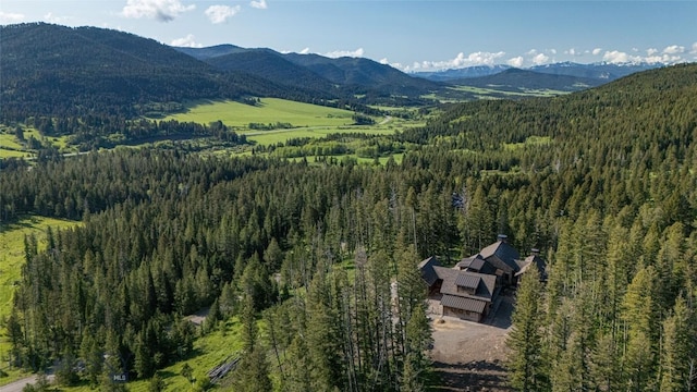 11310 Taiga Trl, Bozeman, MT 59715 - aerial view of property's location featuring a heavily wooded area and a mountain backdrop