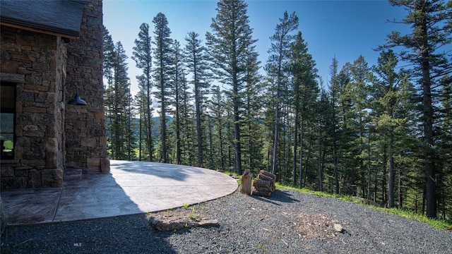 11310 Taiga Trl, Bozeman, MT 59715 - view of patio featuring a view of trees
