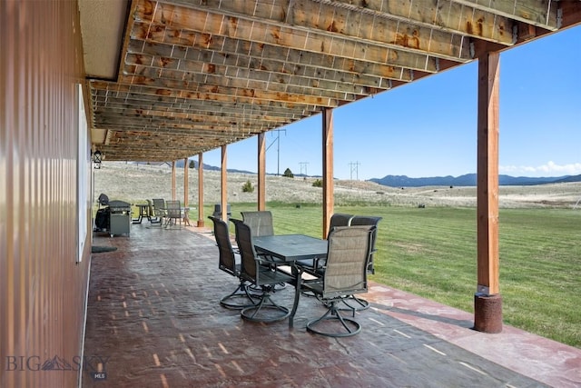 590 Coyote Ln, Butte, MT 59701 - view of patio with a mountain view and outdoor dining area