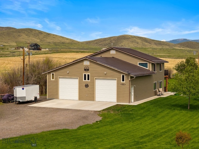247 Clarks Lookout Rd, Dillon, MT 59725 - view of side of home featuring a mountain view, dirt driveway, a yard, and metal roof