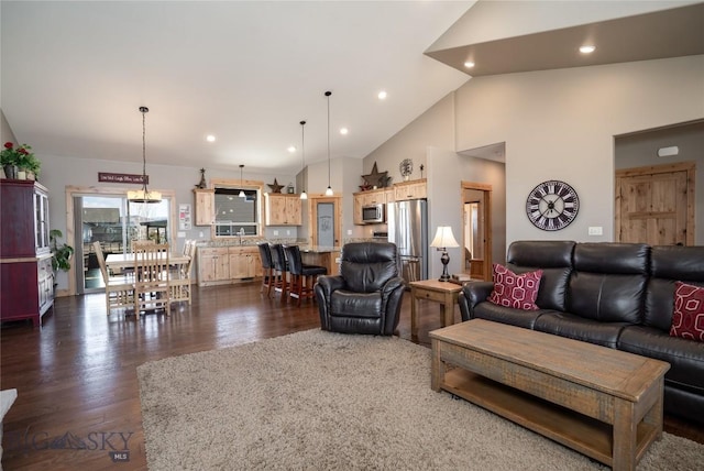 154 Nellie Ct, Manhattan, MT 59741 - living area with dark wood-style floors, high vaulted ceiling, and recessed lighting