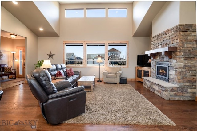 154 Nellie Ct, Manhattan, MT 59741 - living area with a high ceiling, a fireplace, and dark wood finished floors