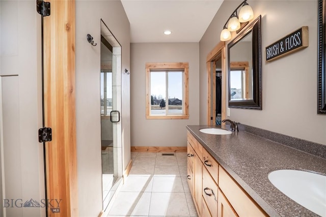 154 Nellie Ct, Manhattan, MT 59741 - full bathroom featuring double vanity, a stall shower, tile patterned floors, baseboards, and recessed lighting