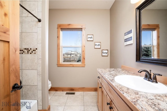 154 Nellie Ct, Manhattan, MT 59741 - bathroom featuring tile patterned flooring, toilet, vanity, and baseboards