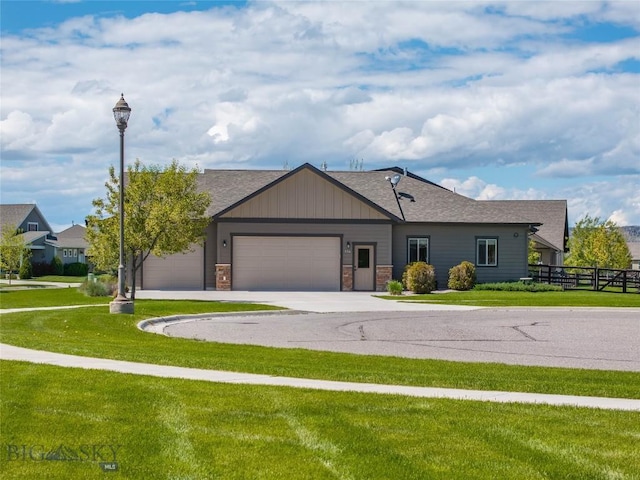 154 Nellie Ct, Manhattan, MT 59741 - single story home featuring a garage, driveway, stone siding, and roof with shingles