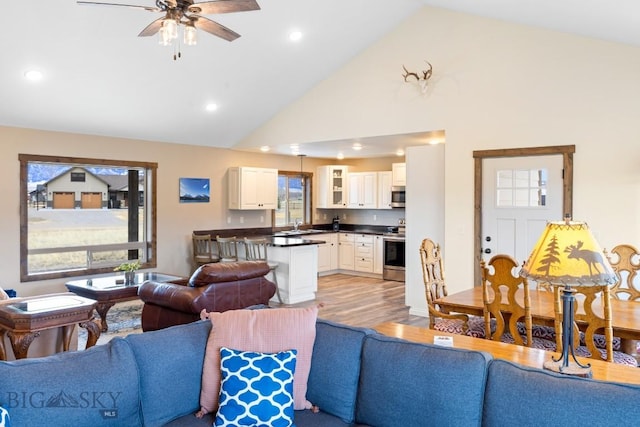 83 Sky Vw, Ennis, MT 59729 - living area featuring ceiling fan, high vaulted ceiling, light wood finished floors, and recessed lighting