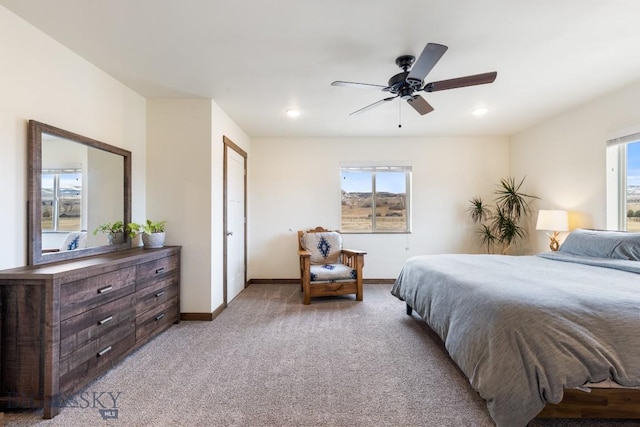 83 Sky Vw, Ennis, MT 59729 - bedroom with multiple windows, light colored carpet, baseboards, a ceiling fan, and recessed lighting