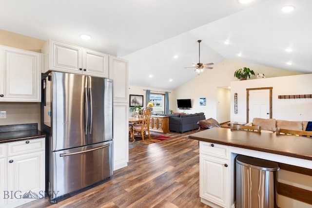 83 Sky Vw, Ennis, MT 59729 - kitchen with freestanding refrigerator, dark countertops, vaulted ceiling, dark wood-style floors, and a ceiling fan