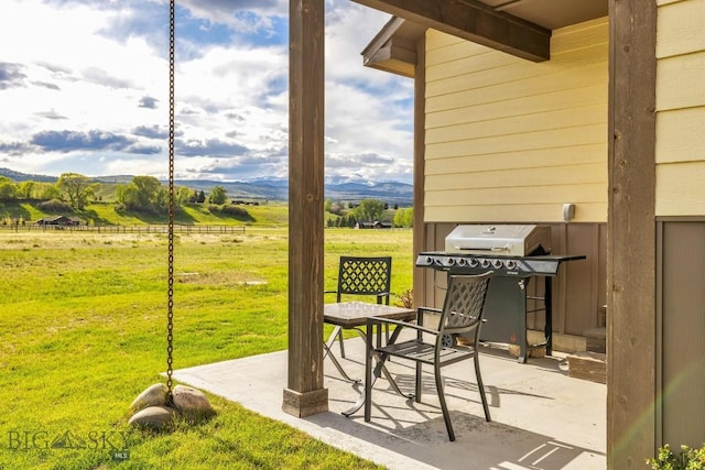 83 Sky Vw, Ennis, MT 59729 - view of patio featuring area for grilling, a mountain view, and a view of countryside