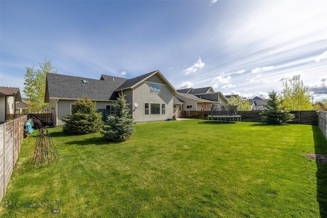 4156 Sunstone St, Bozeman, MT 59718 - exterior space with a trampoline and a fenced backyard