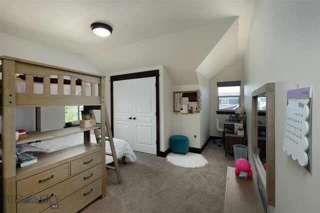 4156 Sunstone St, Bozeman, MT 59718 - carpeted bedroom with baseboards, vaulted ceiling, and a closet